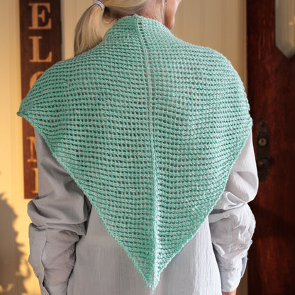 Red Heart Cool Breeze Knit Shawl Cool Breeze Knit Shawl made using Red Heart yarn in a styled lifestyle setting
