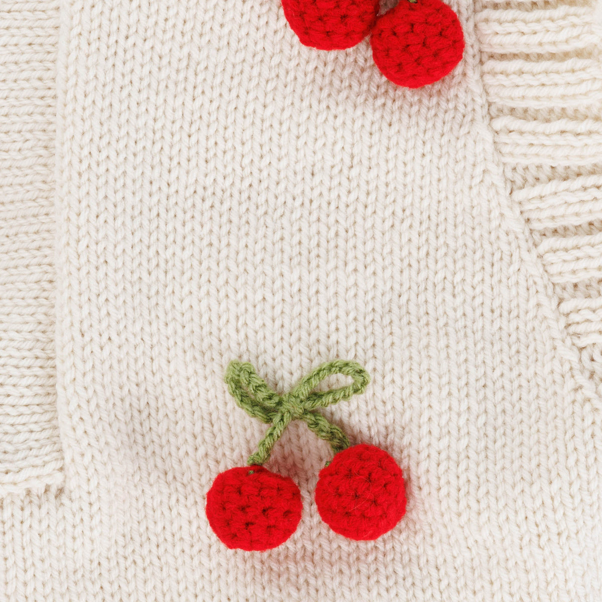 Knit Cardigan With Crochet Cherry made using Red Heart yarn