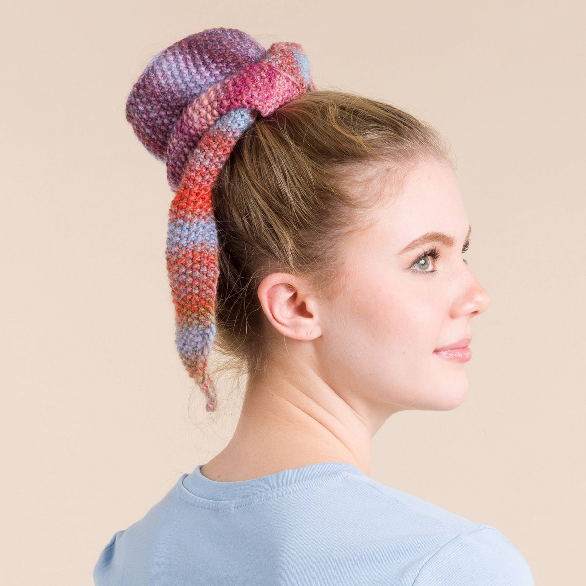 Knit Bow made in Red Heart Roll With It Melange Yarn