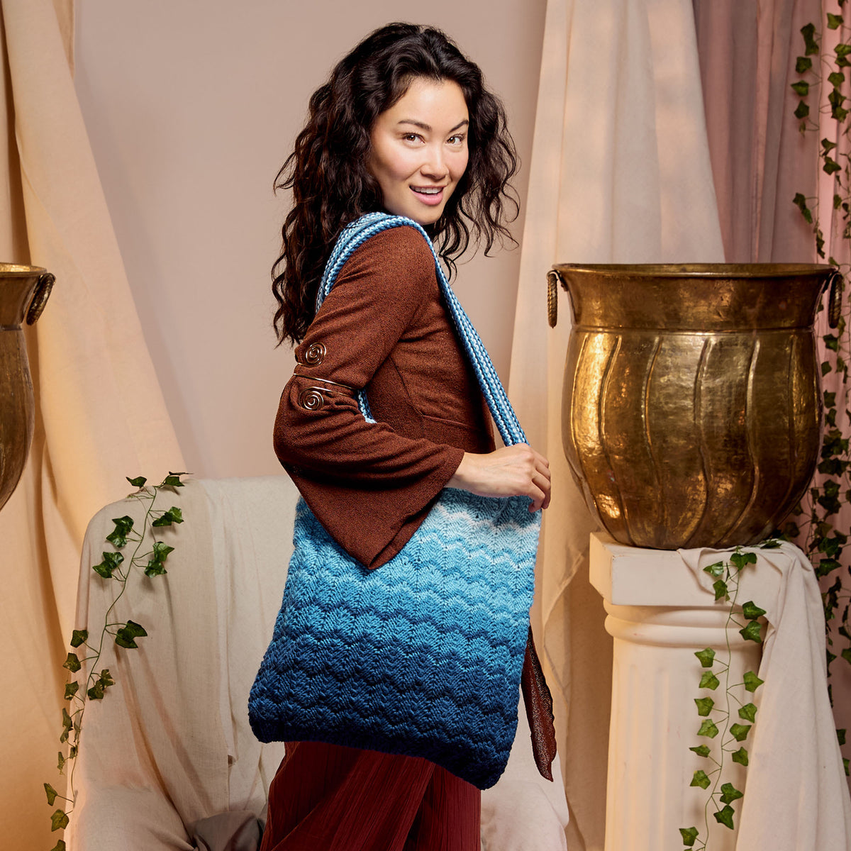 Coastal Life Knit Bag made using Red Heart yarn in a styled lifestyle setting