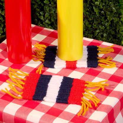 Red Heart Red White and Blue Woven Coasters Red White And Blue Woven Coasters made using Red Heart yarn in a styled lifestyle setting